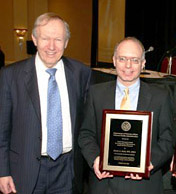 Dr. Joel Kupersmith is shown presenting the award to Dr.Asch