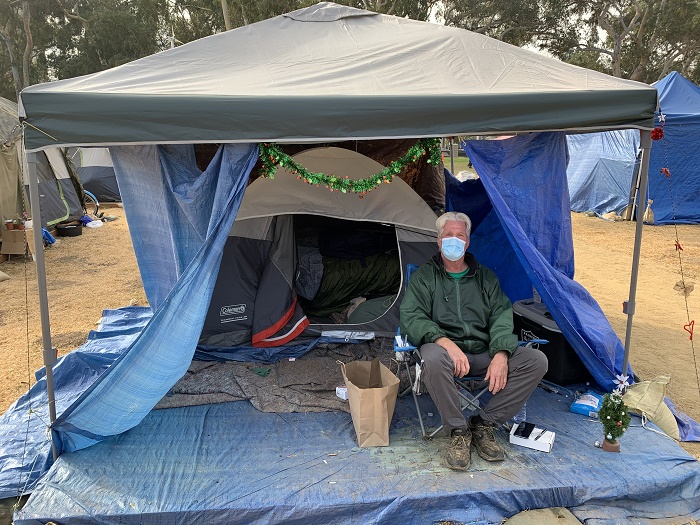 White, male, homeless veteran  under his tent
